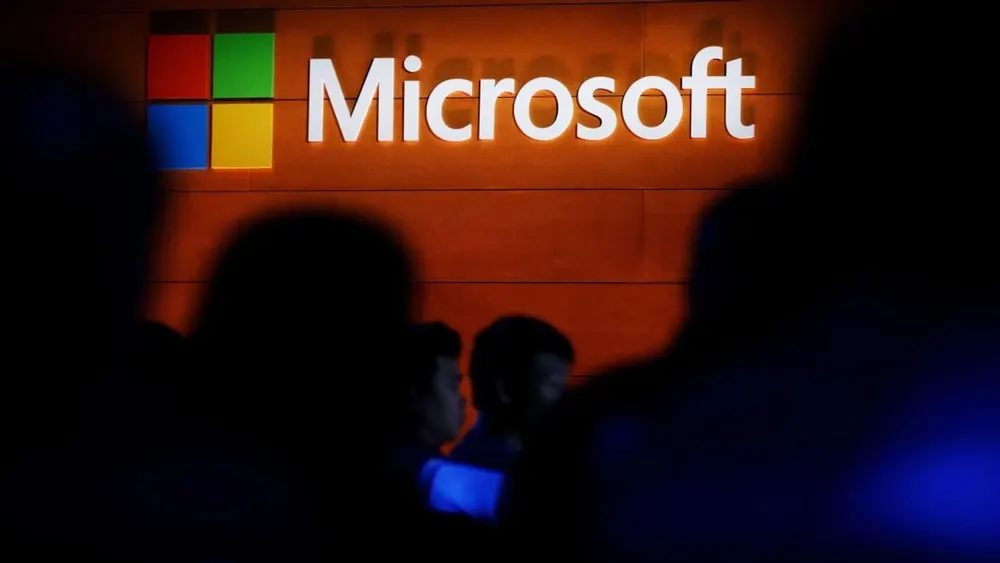 Microsoft corporate campus entrance signage in Redmond, Washington surrounded by trees and glass enterprise office buildings
