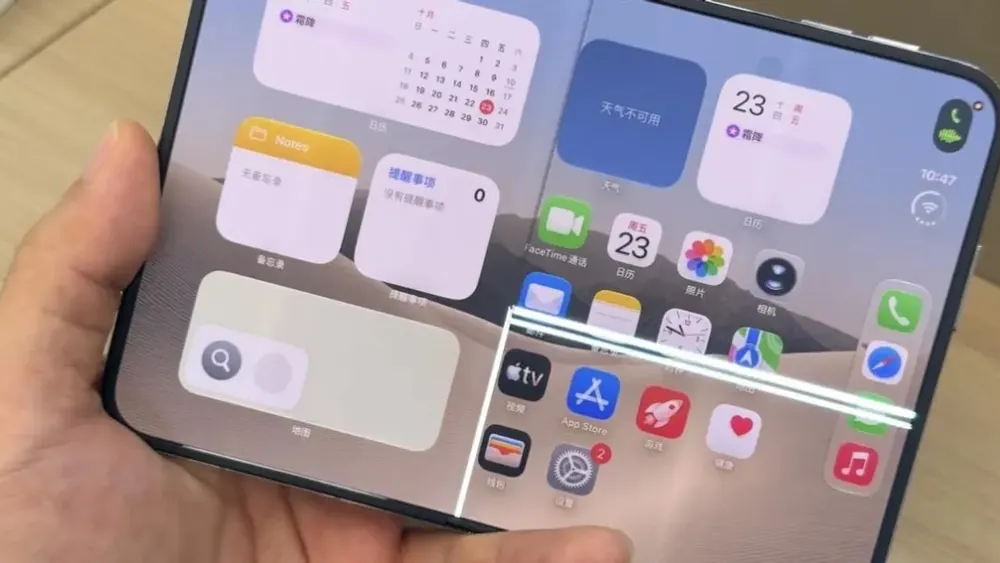 Dissected titanium hinge mechanism and folding chassis of the Apple iPhone Duo