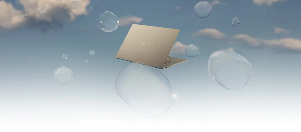 ASUS Zenbook A16 laptop floating against a soft blue backdrop