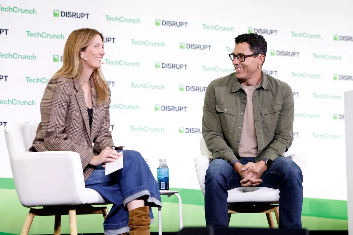 Rivian founder and CEO RJ Scaringe speaking onstage about in-car AI agents at TechCrunch Disrupt in San Francisco