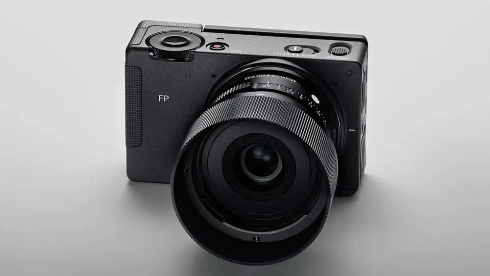 Sigma FP2 compact full-frame mirrorless camera shown from front and rear angle with tilting LCD screen