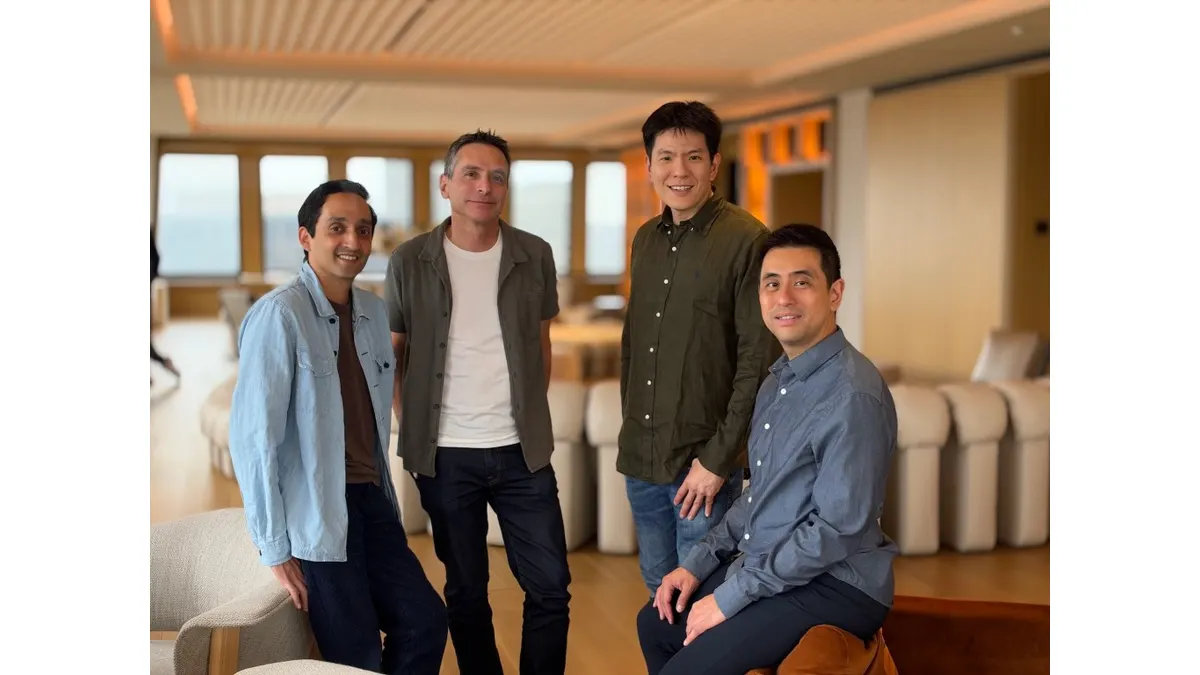 Mintive founders and colleagues photographed together in an indoor meeting space.