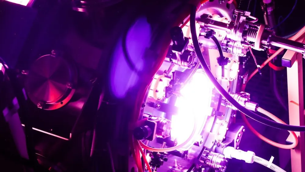 Helion Energy Polaris fusion reactor core illuminated by intense purple plasma discharge and magnetic compression coils