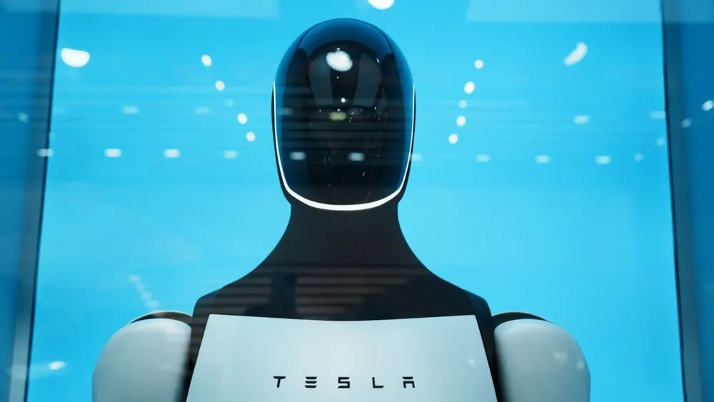 Tesla Optimus humanoid robotic prototype standing in an engineering testing facility