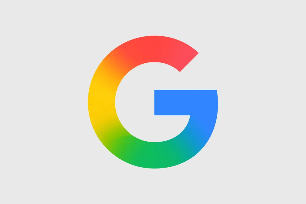 Official Google brand logo photographed in studio lighting on a clean neutral backdrop