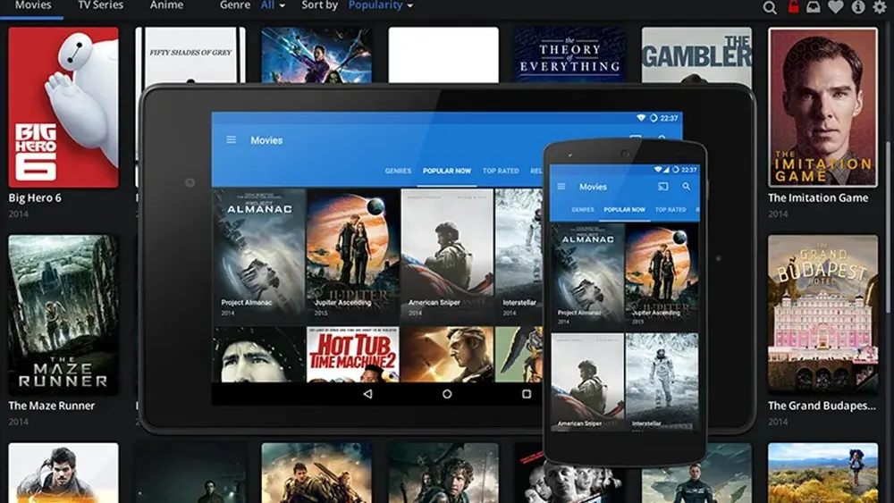 Desktop computer displaying the Popcorn Time media interface and streaming player software
