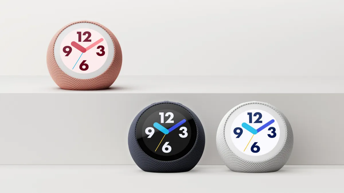 Amazon Echo Time smart alarm clocks in Coral Pink, Graphite, and Glacier White, showing colorful analog clock faces