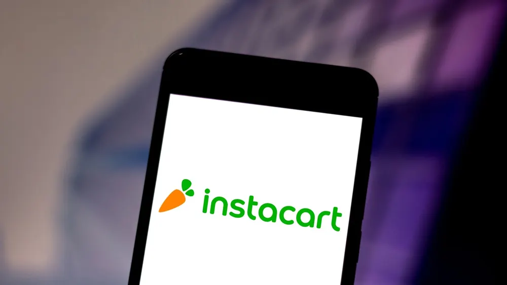 Instacart corporate logo and mobile grocery delivery application branding on neutral commercial backdrop