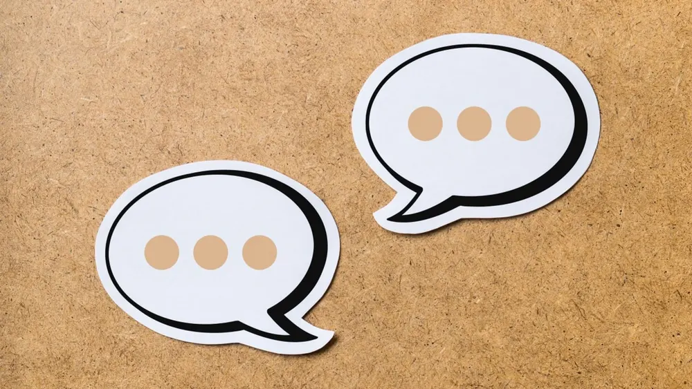 Smartphone user interacting with autonomous AI assistant through native SMS text messaging interface