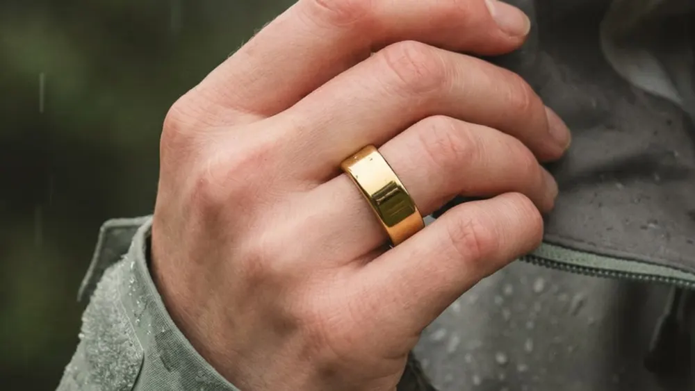 Ultrahuman Ring Pro smart ring displayed on a minimal pedestal highlighting internal biosensors and seamless titanium finish
