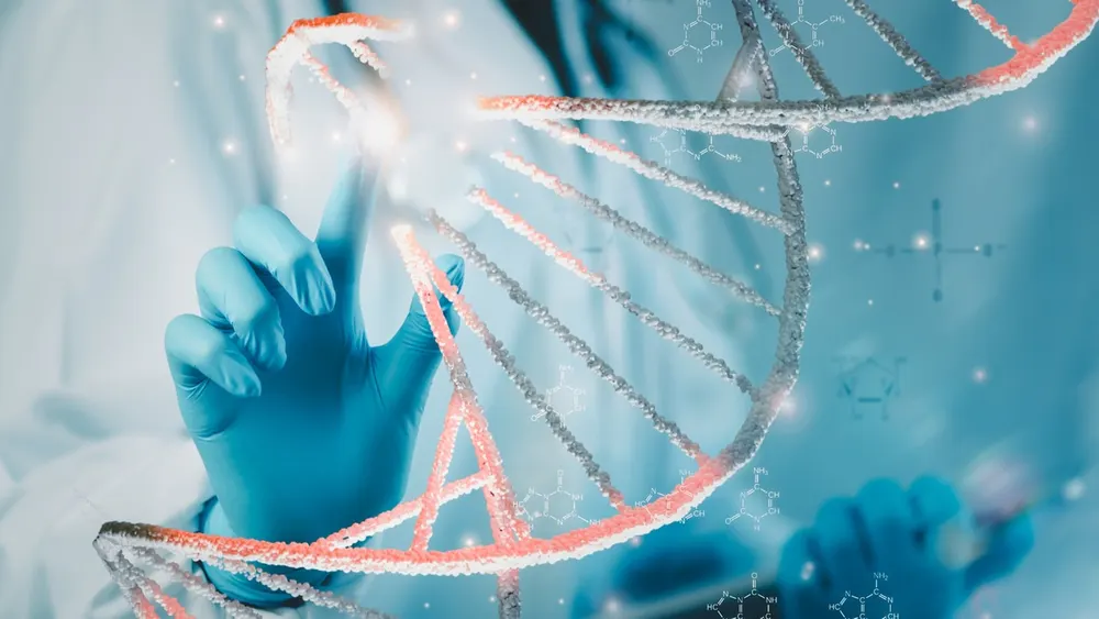 Life sciences researcher examining computational biology datasets and molecular simulations in a biosecurity laboratory